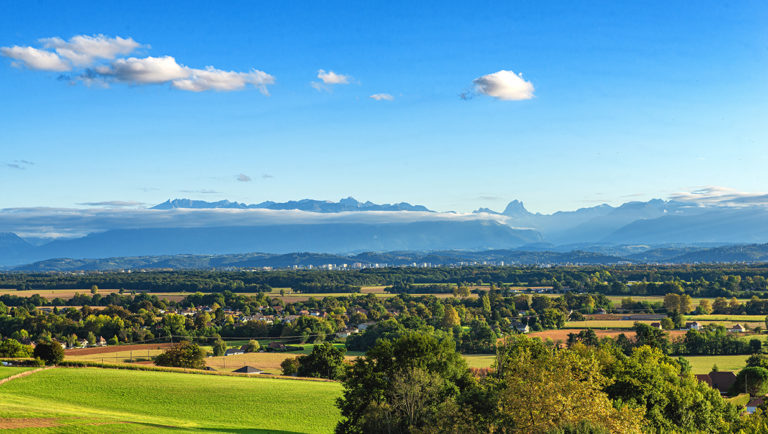 a landscape of Pau city, Pyrenees mountains on background